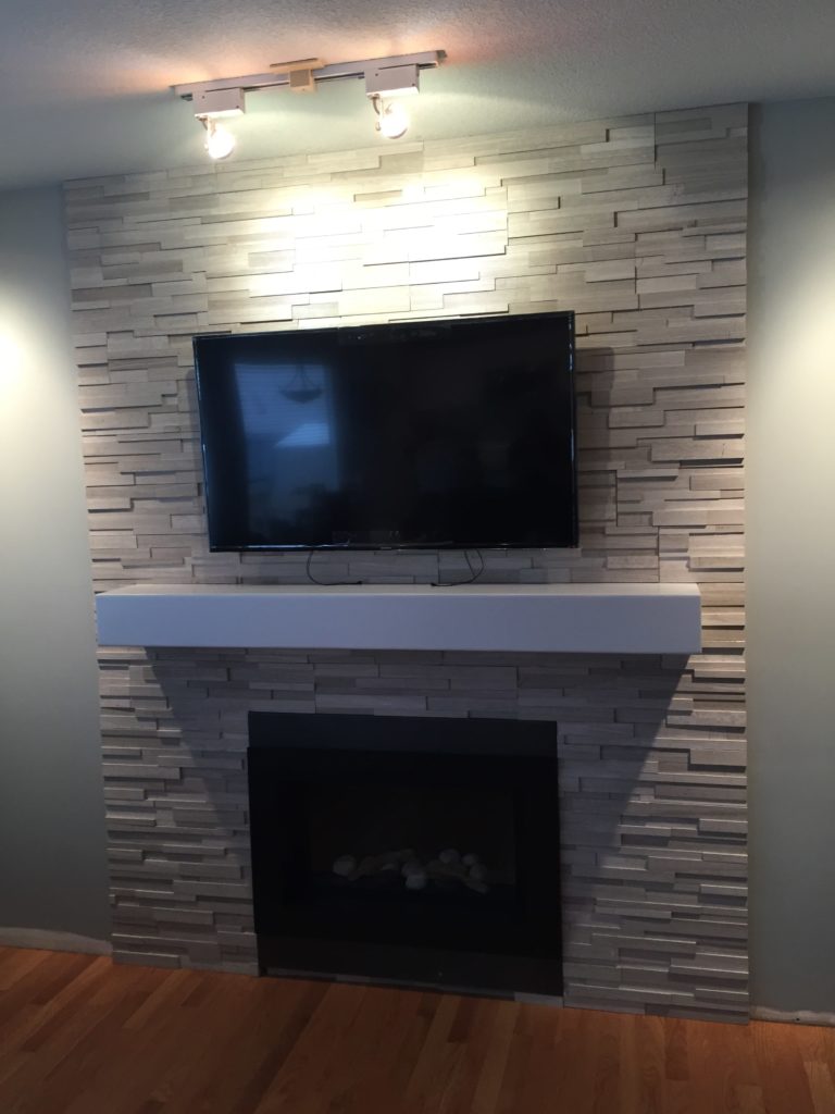 renovated basement with fireplace