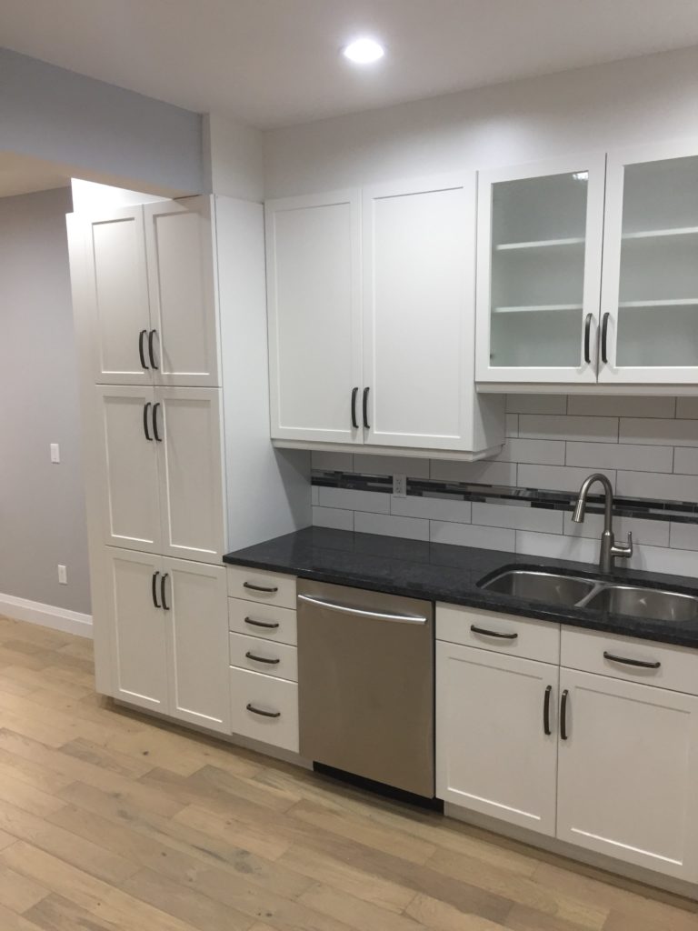 kitchen with white cabinets